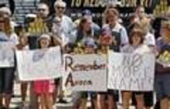 Aurora victims honored; gun groups rally